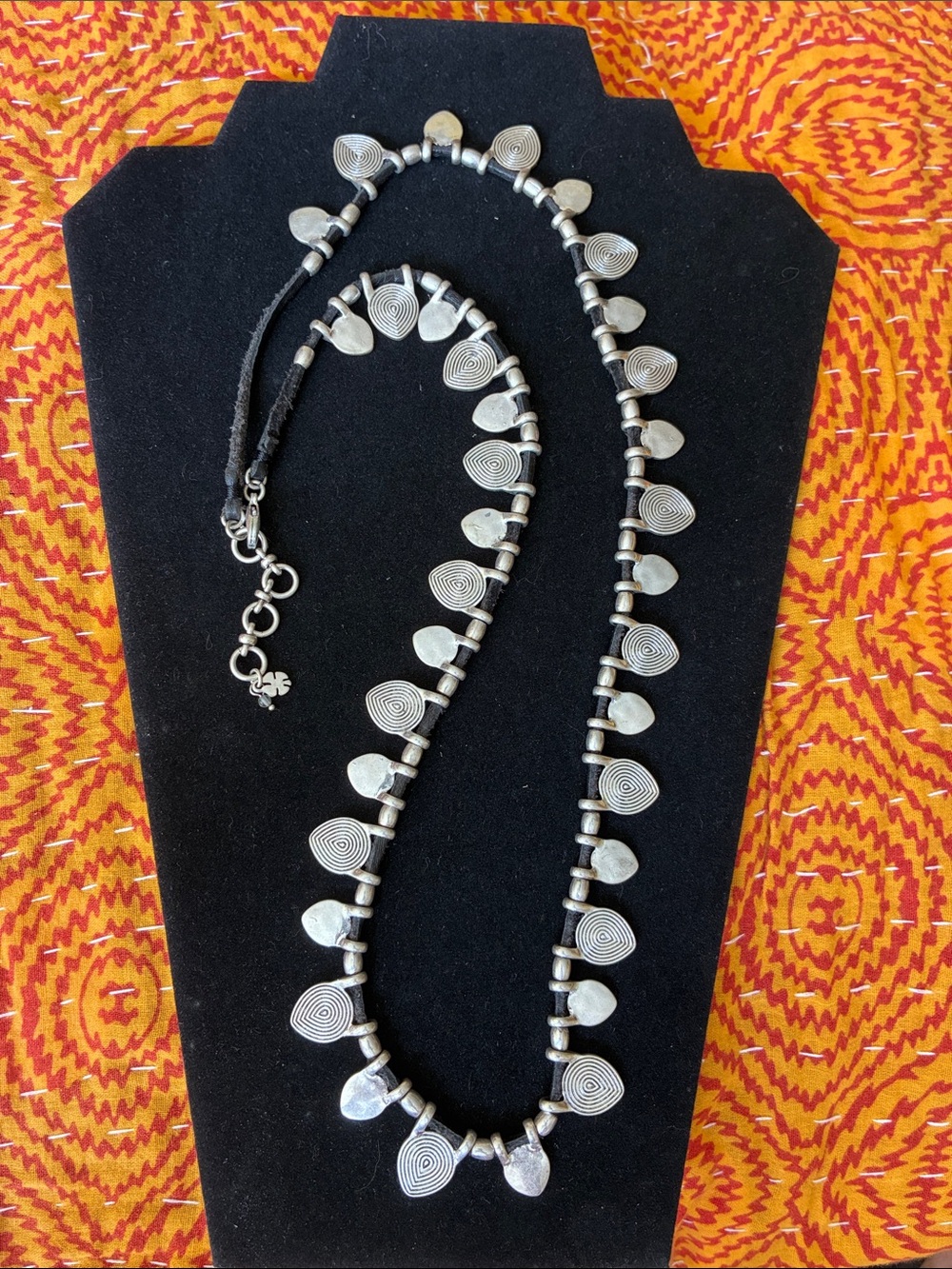 Lucky silver-tone necklace on black suede cord